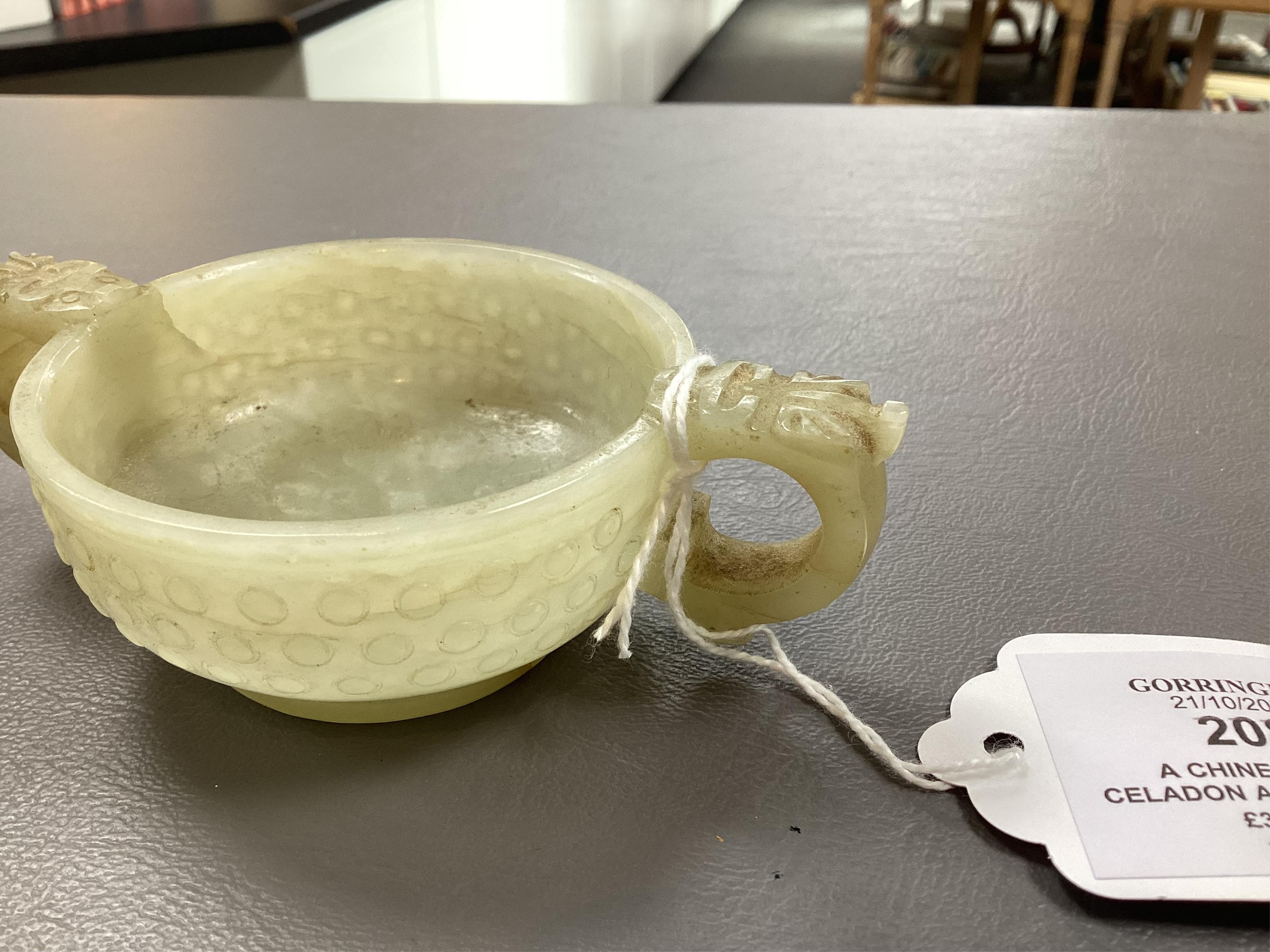 A Chinese pale celadon and russet veined jade cup, 17th century